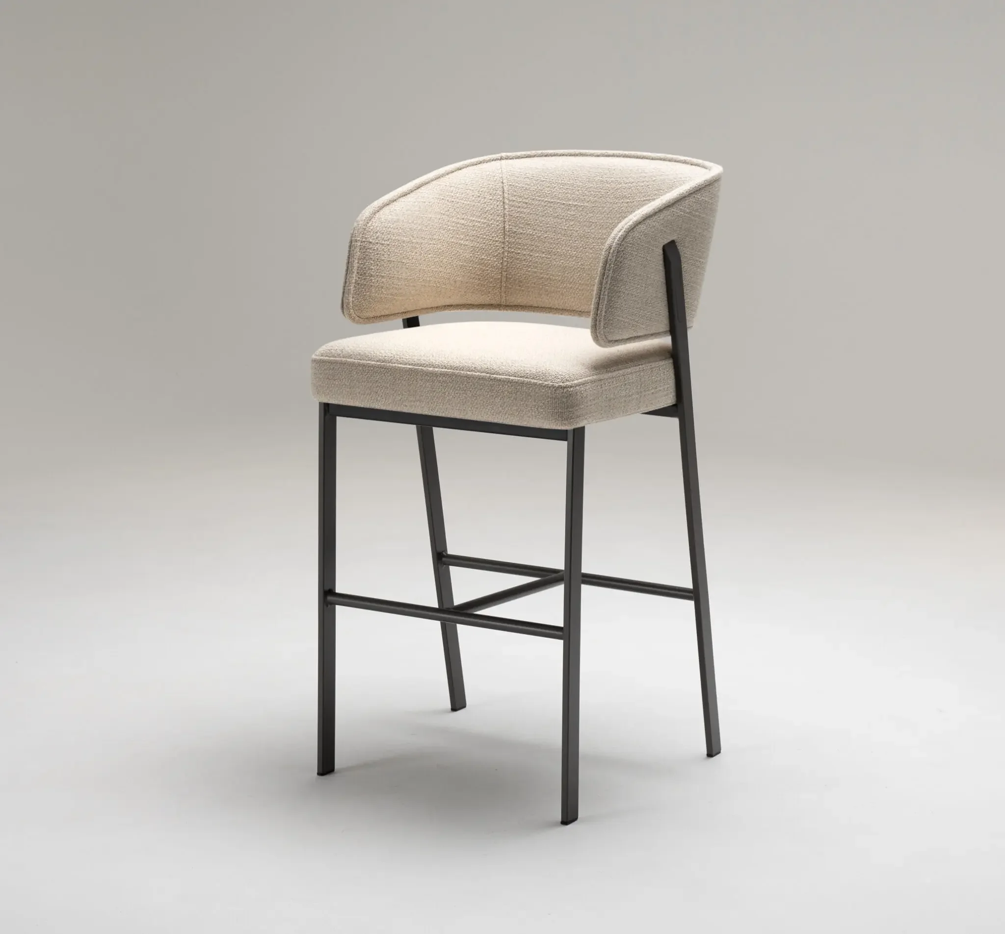 Madison Stool angled view highlighting elegant metal frame and wraparound design