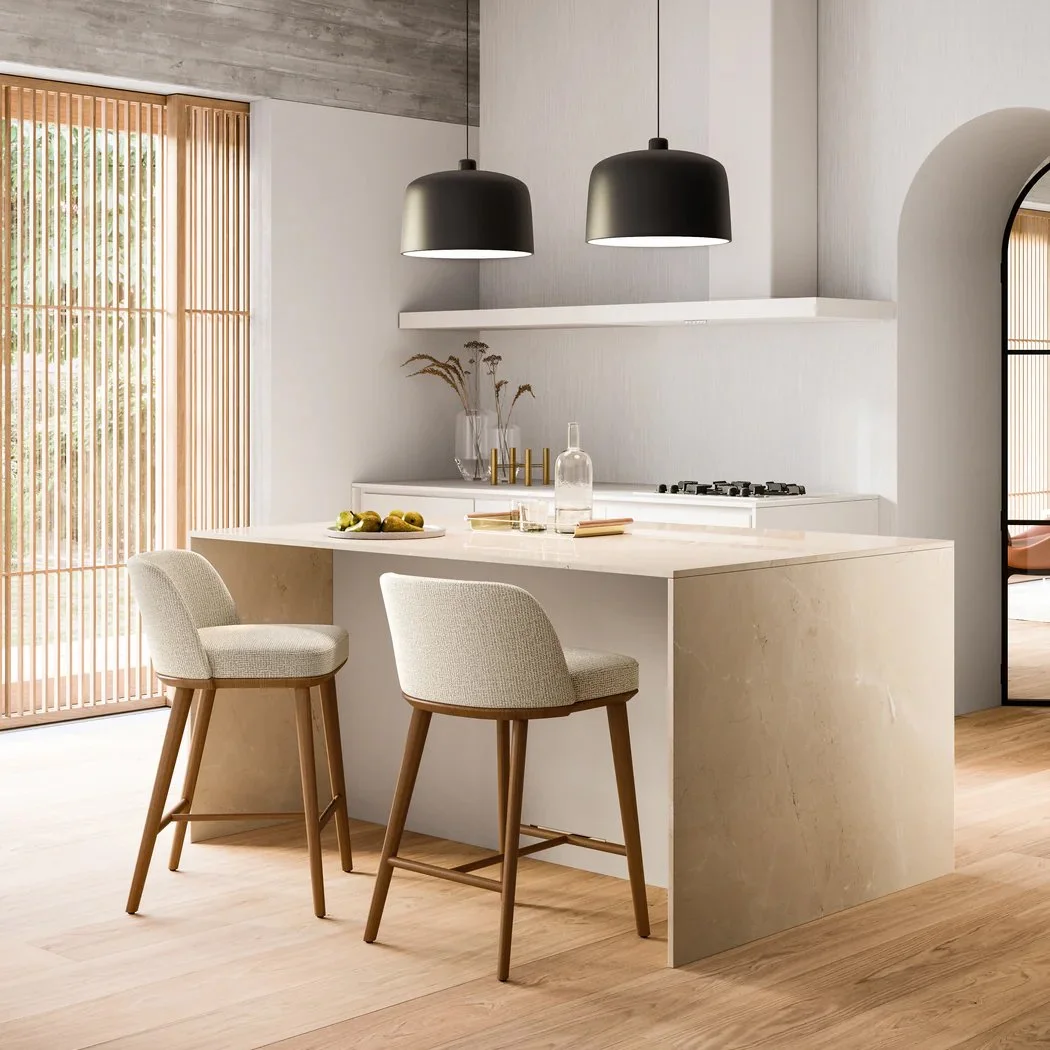 Set of Calligaris Foyer Stools in neutral tones around a modern kitchen island