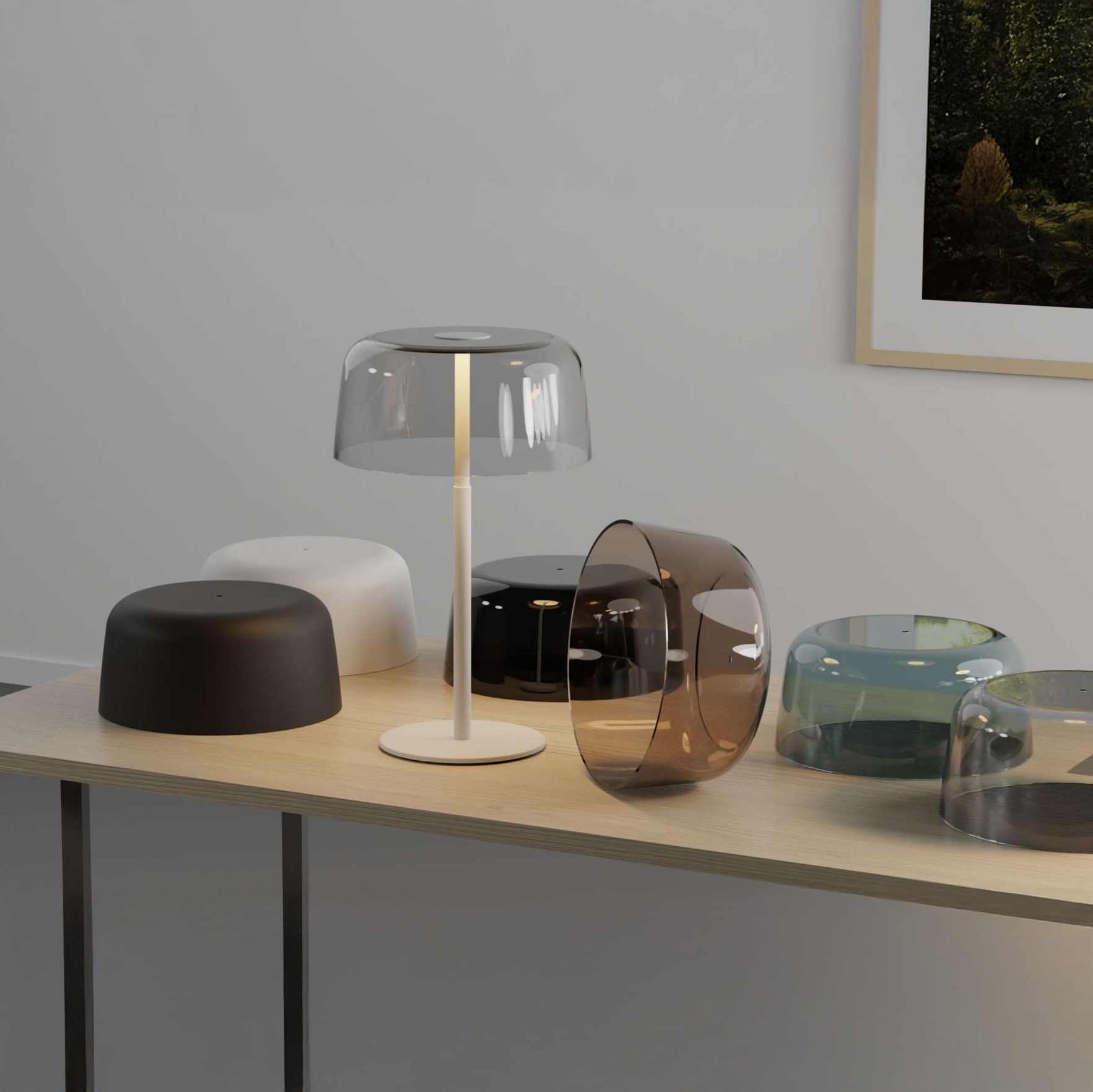 Yurei Lamp collection in various glass finishes displayed on table
