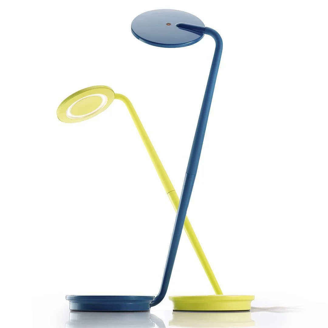 Group of Pixo Plus desk lamps in assorted colors including orange, blue, and white
