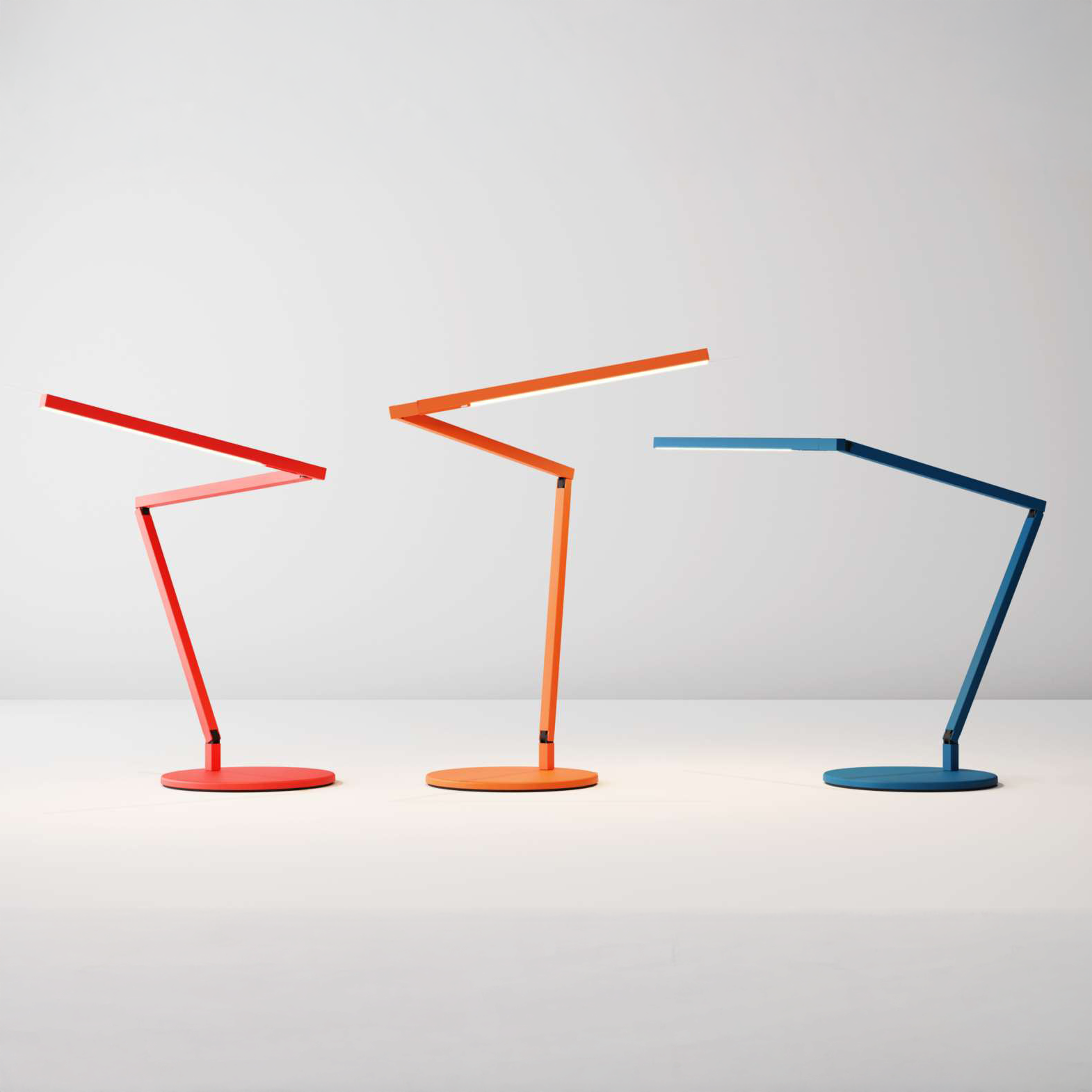 Koncept Z-Bar Desk Lamps in red, orange, and blue – contemporary LED task lights