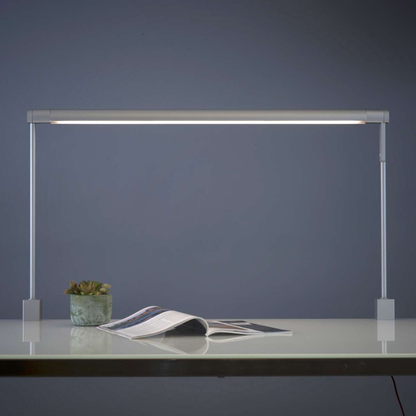 Koncept Sobre Task Light illuminating workspace with book