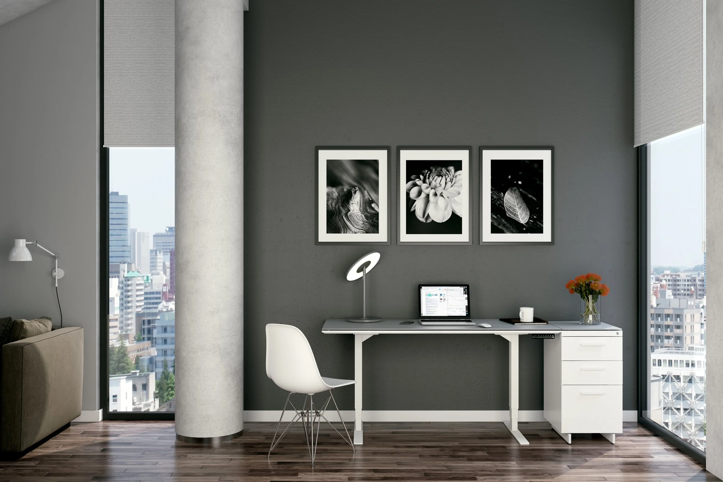 Centro Sit + Stand Desk in bright modern office space with framed black and white artwork and minimalist decor