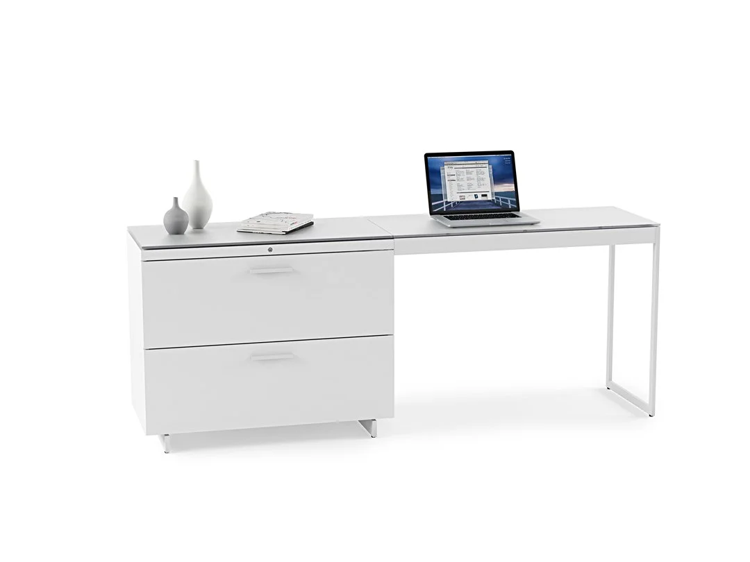 Centro Lateral File Cabinet placed under a white desk with laptop and decor in clean office setup