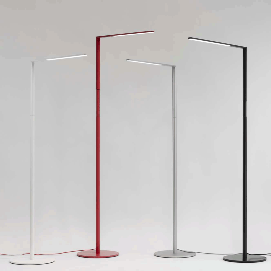 Trio of Koncept Lady 7 Floor Lamps in red, white, and black finishes
