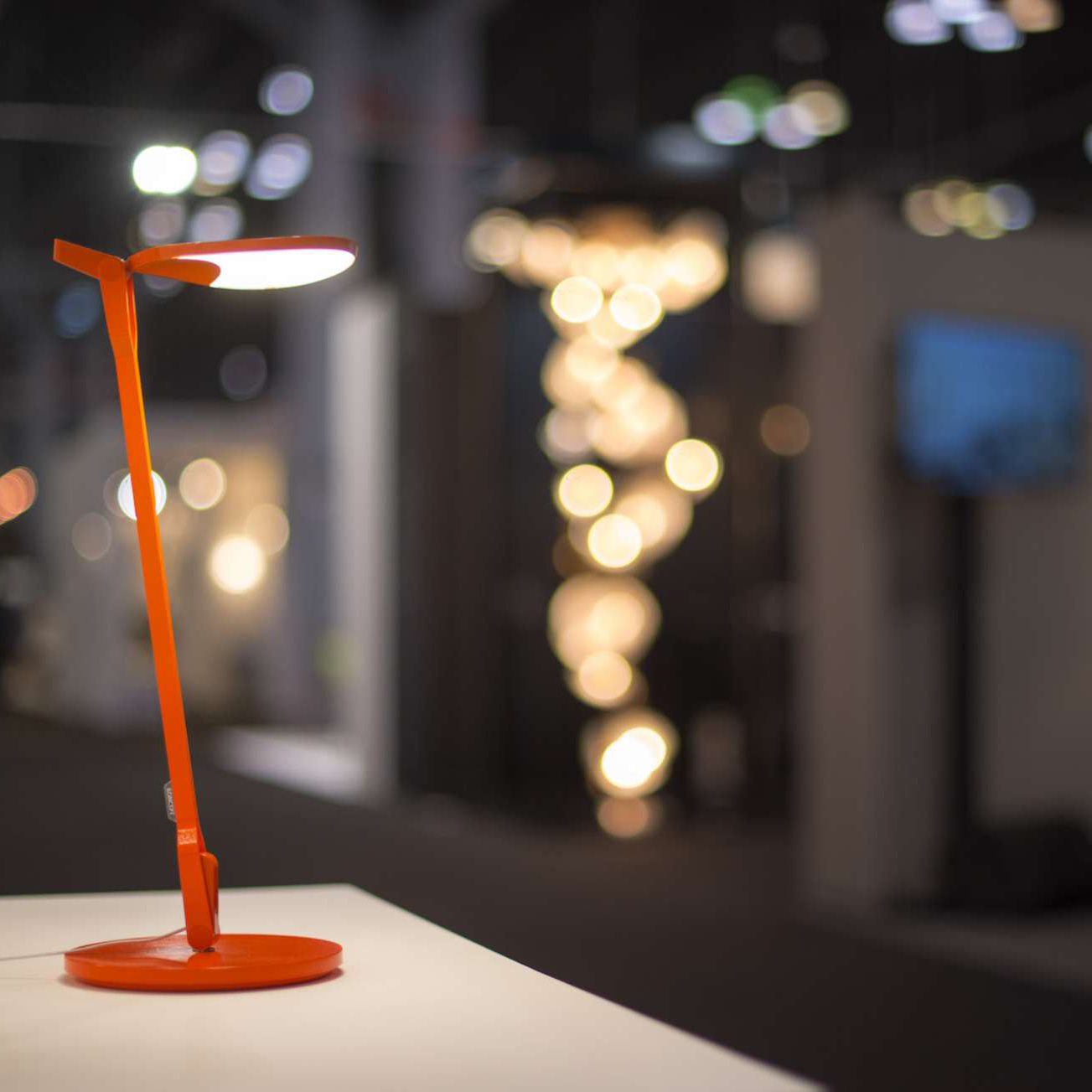 Orange Splitty Desk Lamp on modern desk