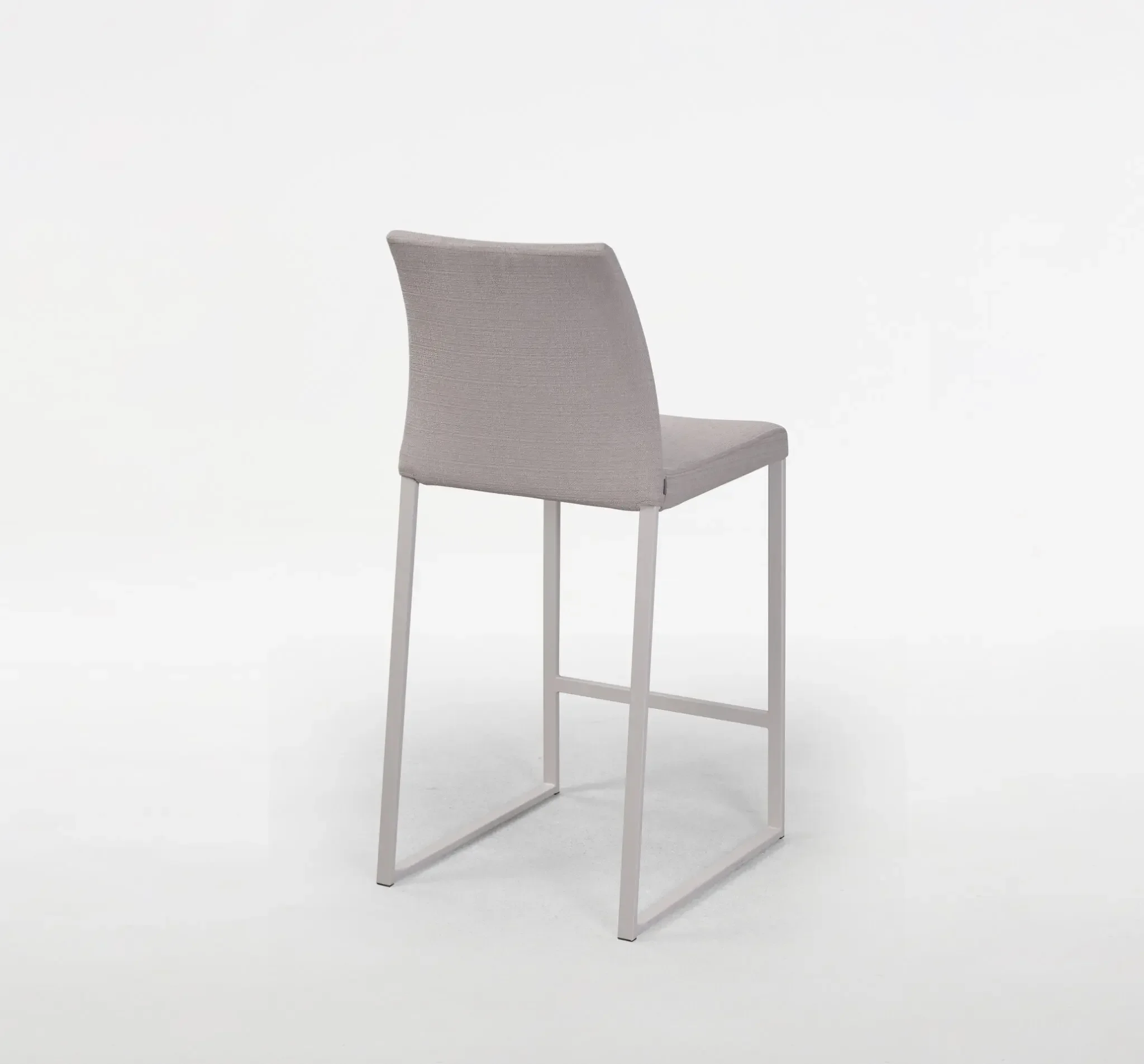 Trica Curvo Counter-height Stool with grey upholstered seat and backrest on light frame