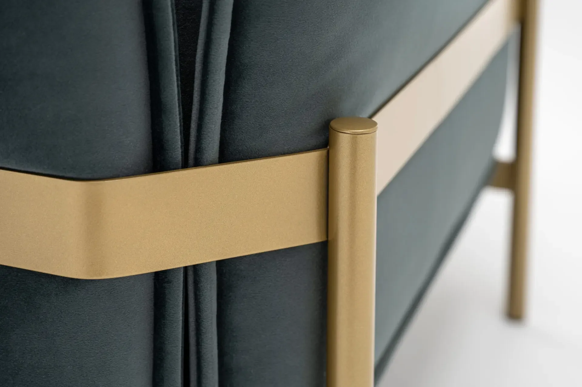 Detailed shot of brass frame and upholstery seam on Trica Le Beaumont Chair
