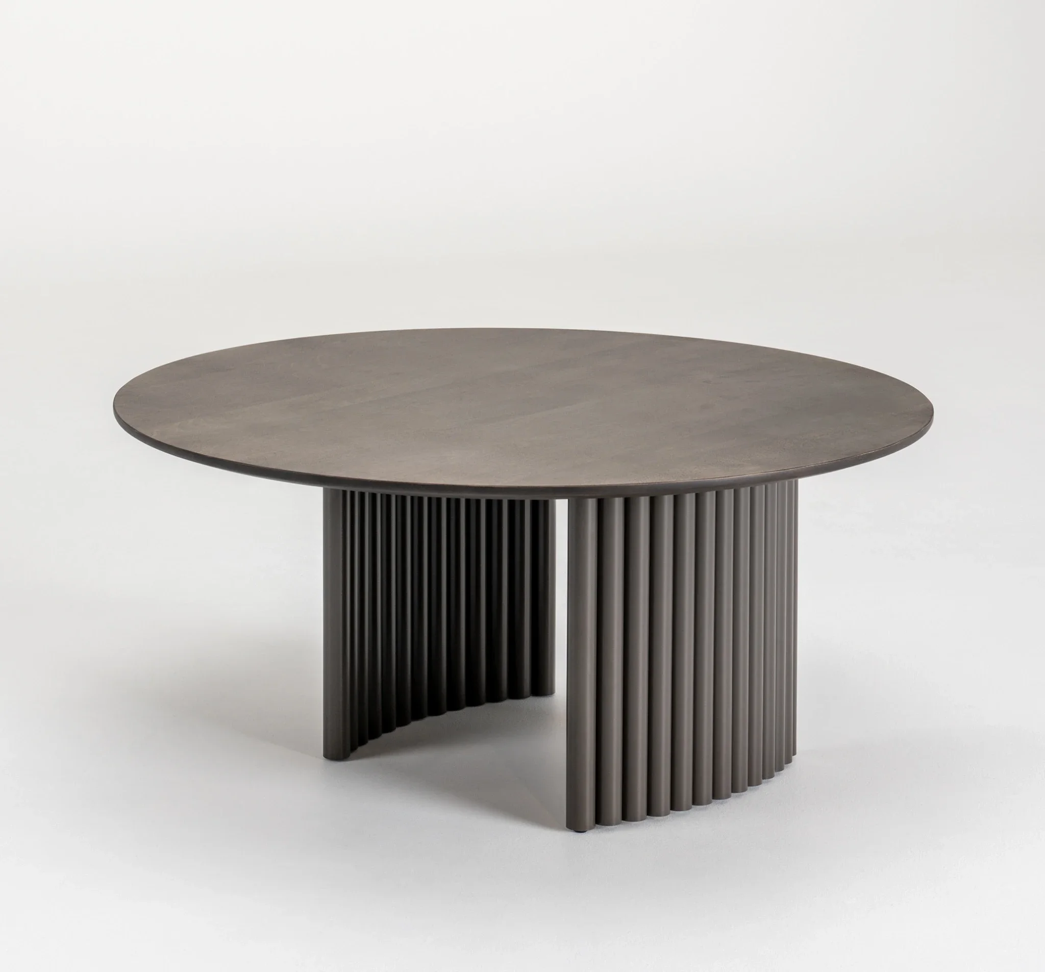 Trica Cove Cocktail Table with round wood top and sculptural fluted base