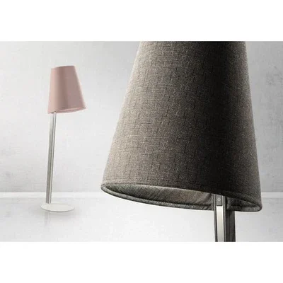 Trica Chapo Lamp with light pink fabric shade and slim metal base on white background