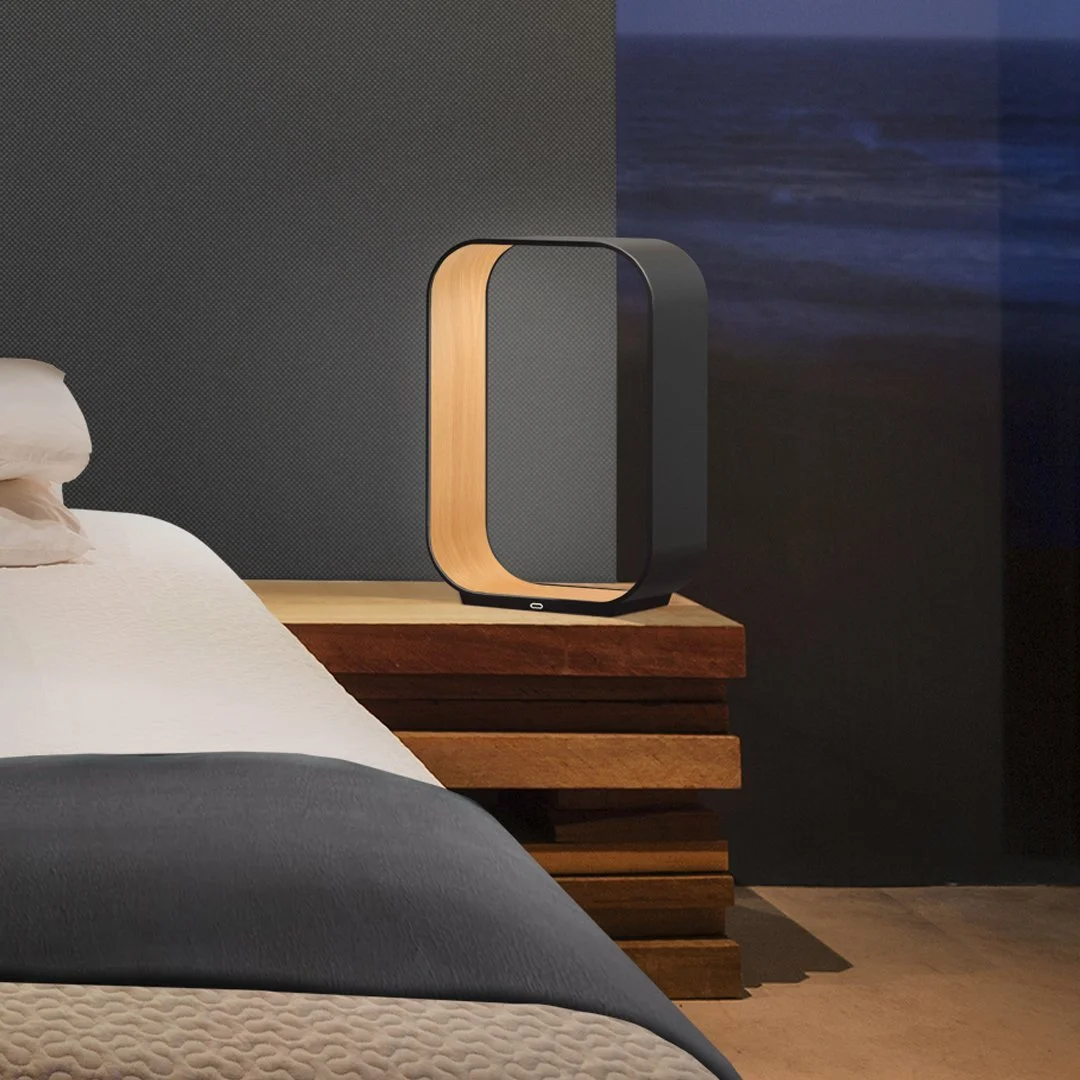 Contour Table Lamp styled on a bedside table