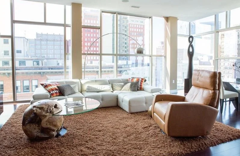 Downtown Indianapolis city scapes pair with contemporary furnishings to make this a show-stopping piece. 