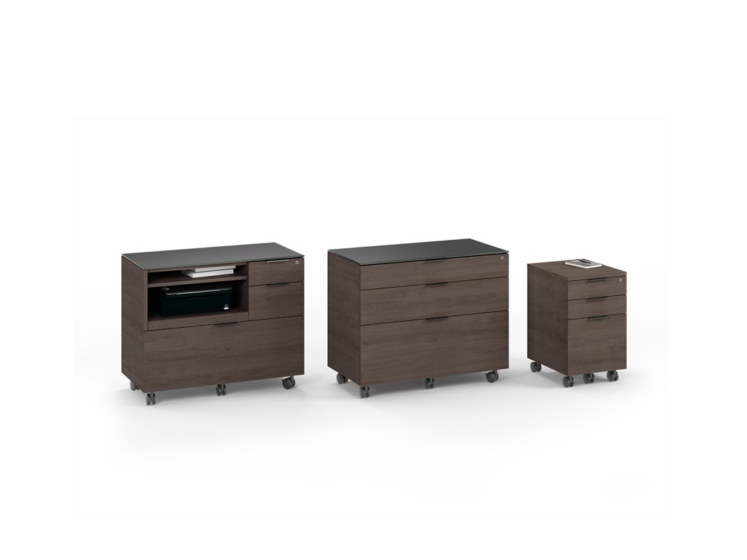 Collection of Sigma cabinets in dark finish with drawers and open shelf