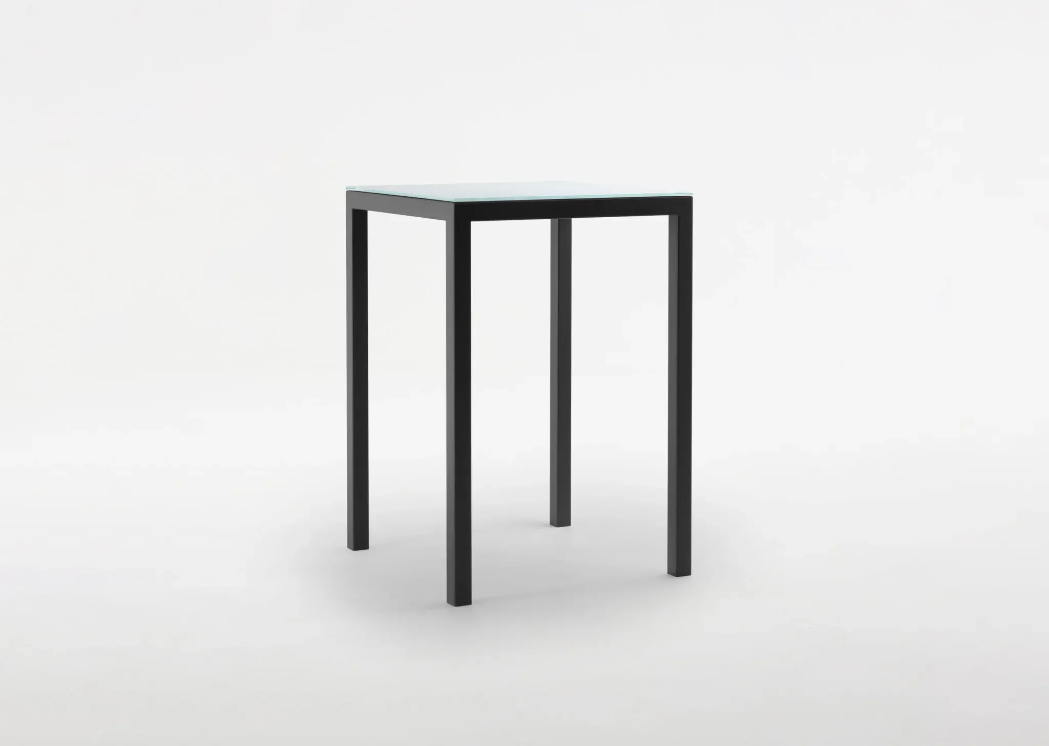 Trica Cubo Counter-height Table with glass top and black metal frame on white background