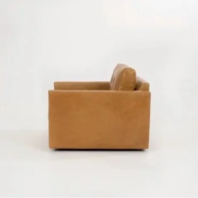 Carmet Chair in tan leather and neutral fabric finishes, showing front, side, and angled views with a sleek swivel base.