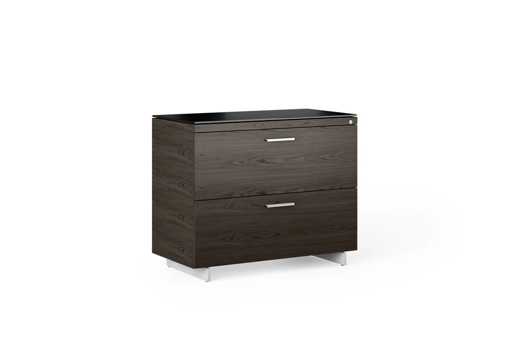 Angled view of Sequel File Cabinet in dark wood showing front and side profile