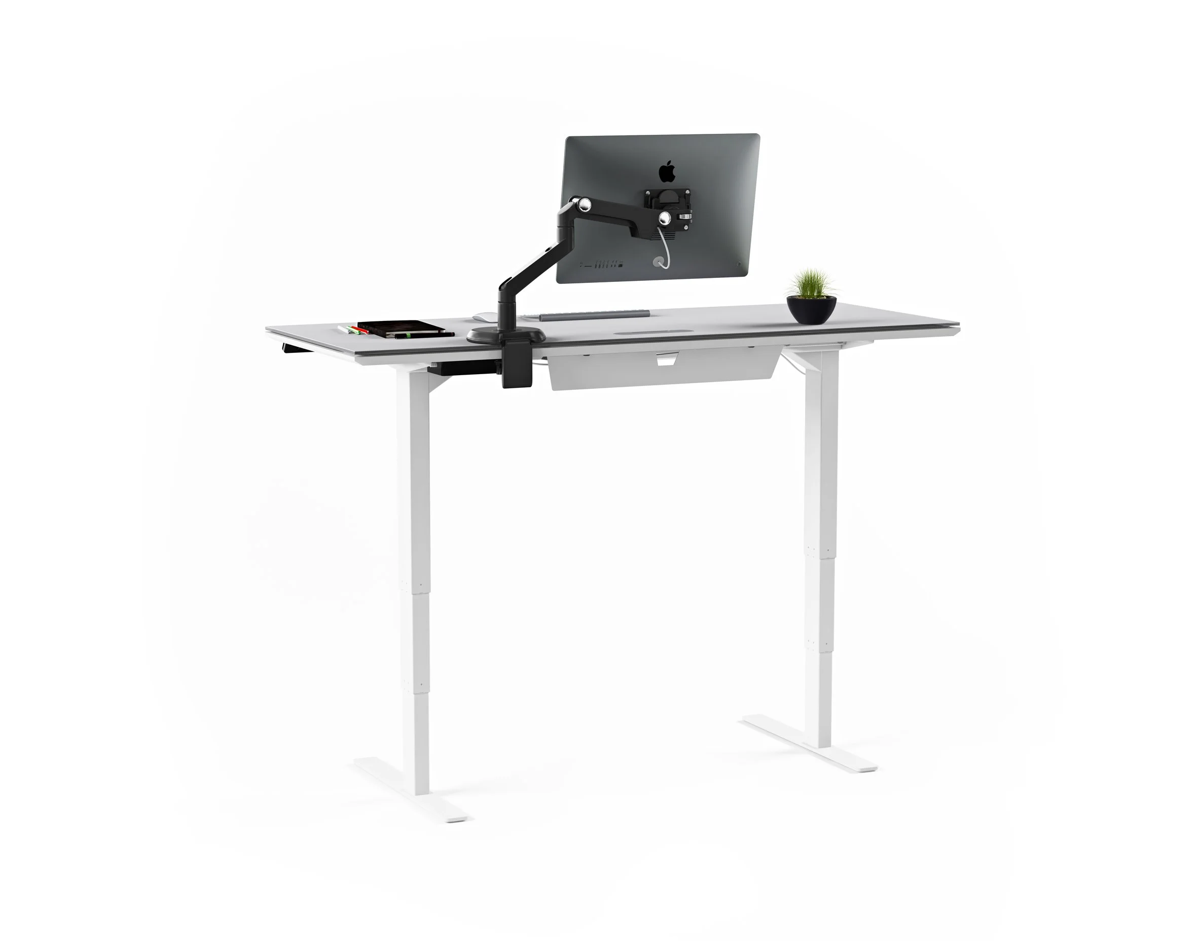 Centro desk in standing position with monitor arm, laptop, and desktop accessories