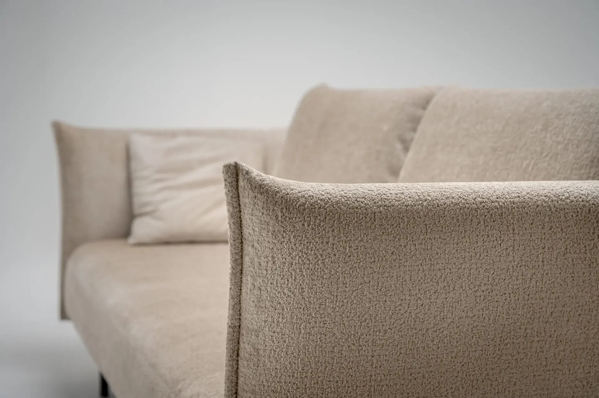 Side view of Trica Le Beaumont Sofa with plush cushions and slim frame