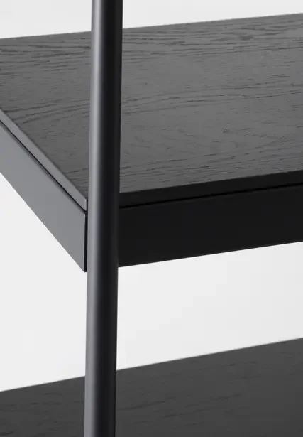 Detailed view of Trica Archive Shelving Unit black wood shelf corner and frame