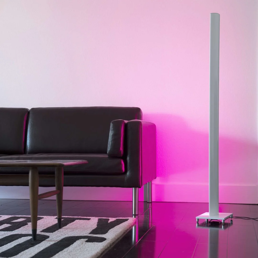 Koncept Tono Mood Light displaying vibrant pink hue in modern living room