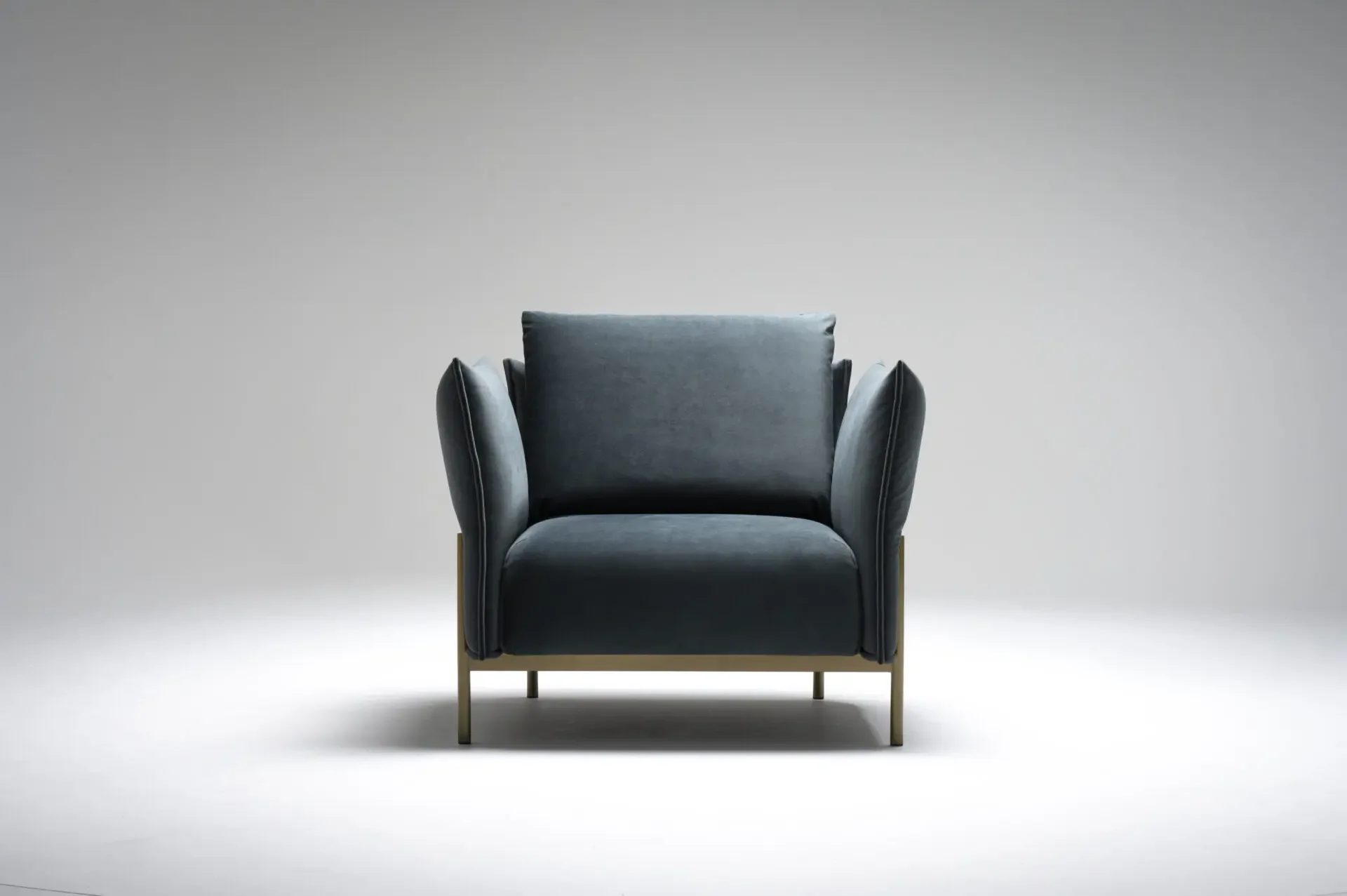 Front view of Trica Le Beaumont Chair with wide cushioned seat and armrests