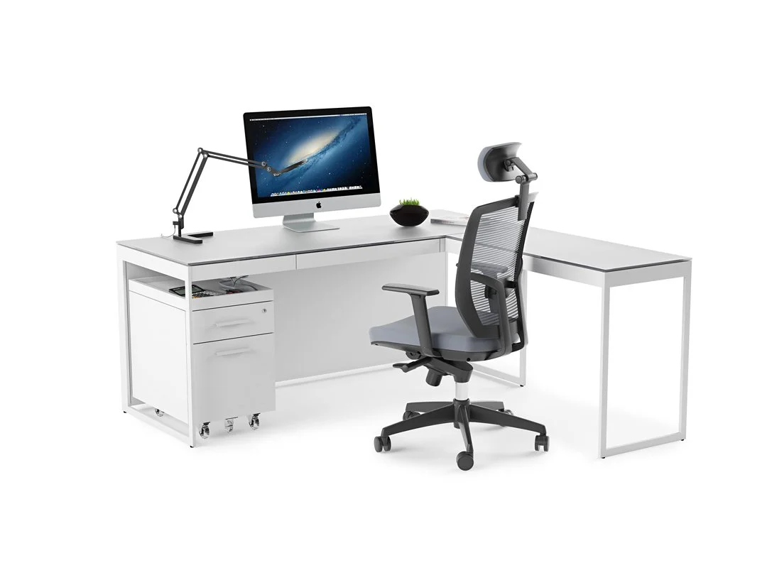 White Centro Desk setup with mobile pedestal and ergonomic chair in use