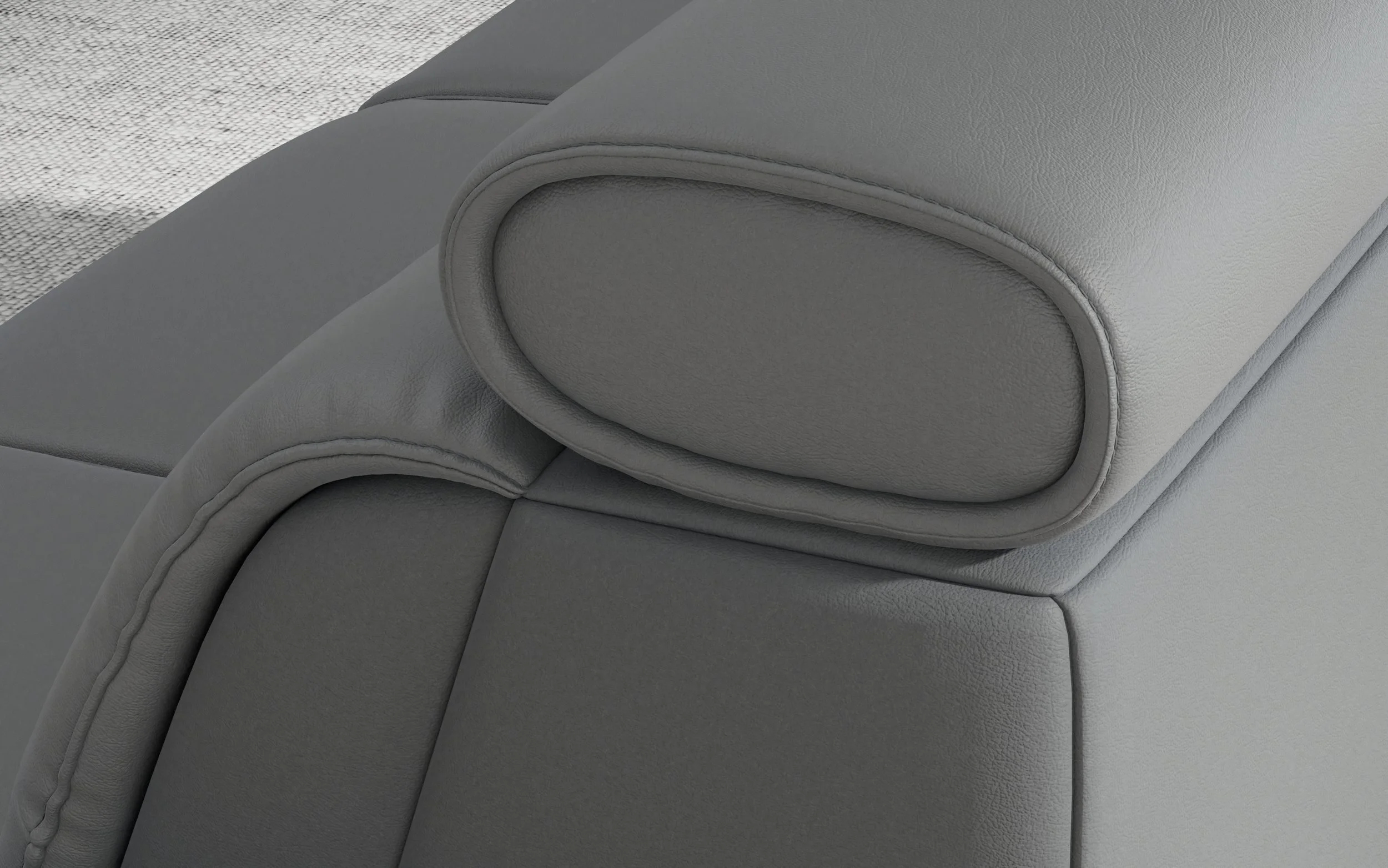 Close-up of Fjords Monte Carlo Sofa headrest in grey leather