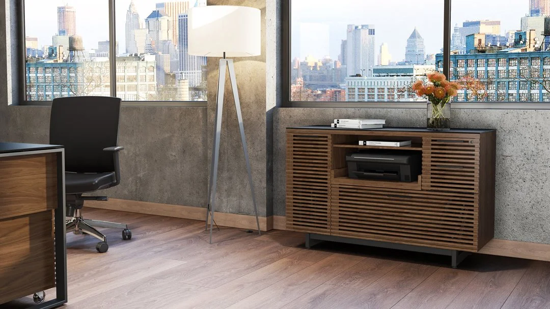 Corridor cabinet styled in urban apartment with walnut finish and city view