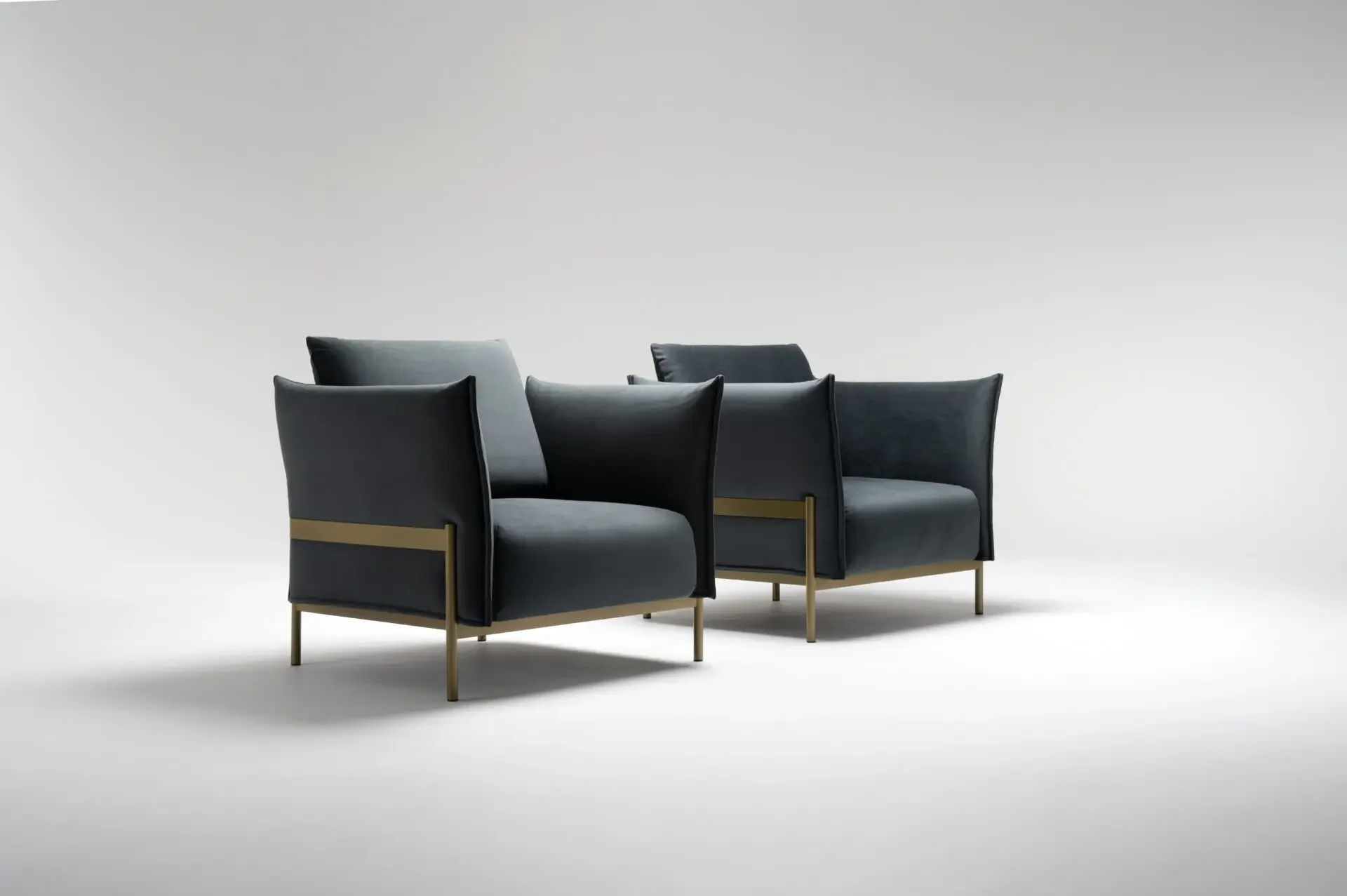 Pair of Trica Le Beaumont Chairs with dark upholstery and brass-finished frames