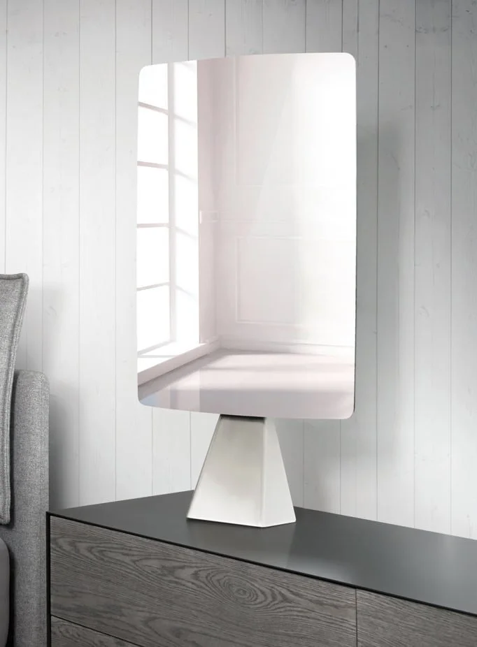 Shadow Mirror reflecting natural light in a white room