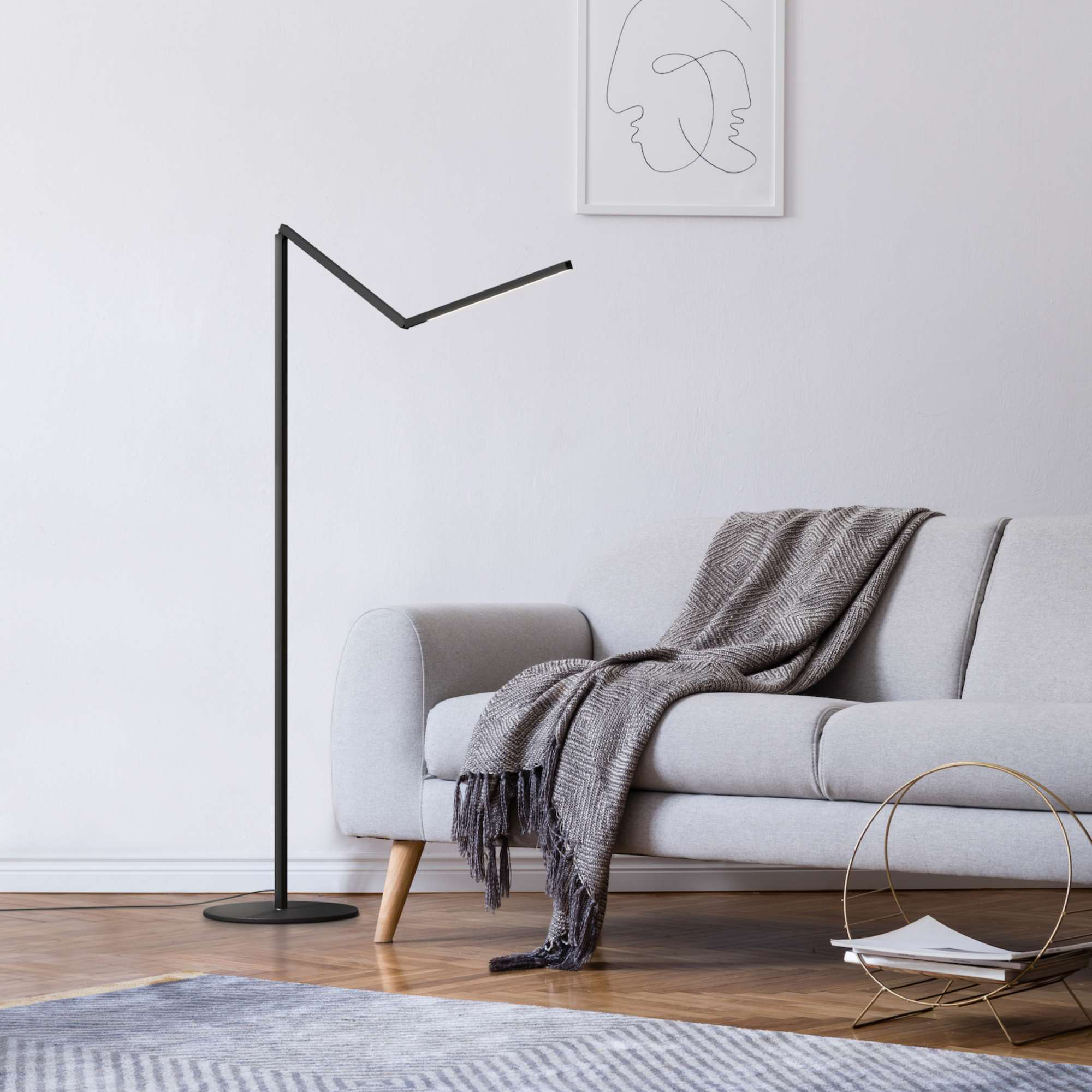 Koncept Z-Bar Floor Lamp next to sofa in modern living room