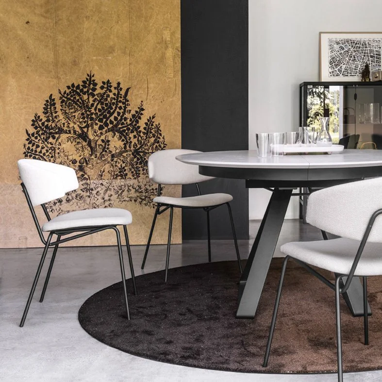 Modern dining room with Calligaris Sophia Chairs around round table