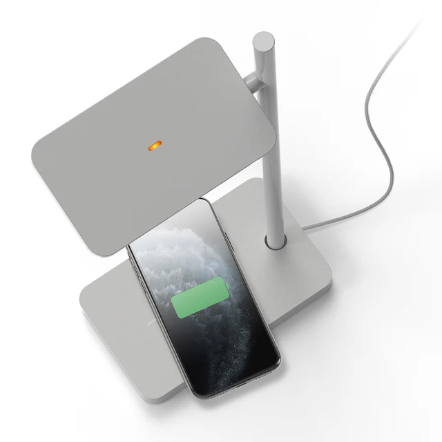 Pablo Talia Table Lamp in white finish charging a smartphone