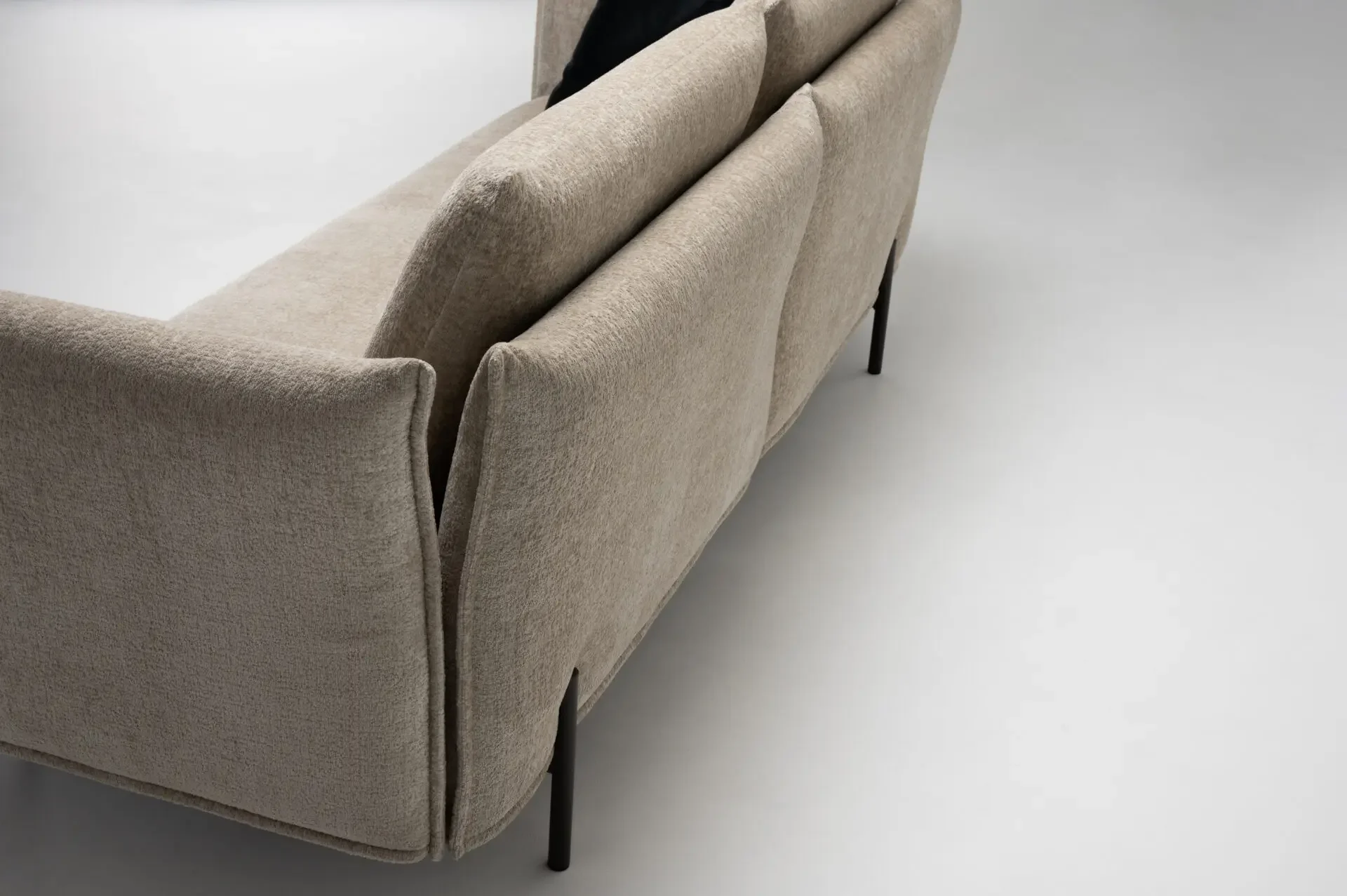 Rear angled view of Trica Le Beaumont Sofa showing slim back and arm design