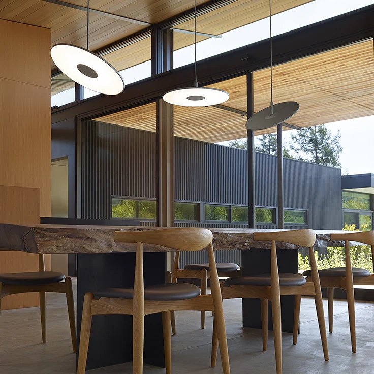 Circa Pendant lamps over dining table in modern home interior