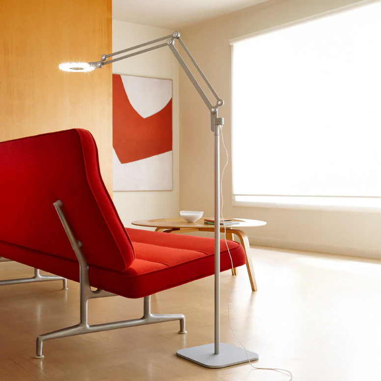 Link Floor Lamp next to a red chair in a modern living room