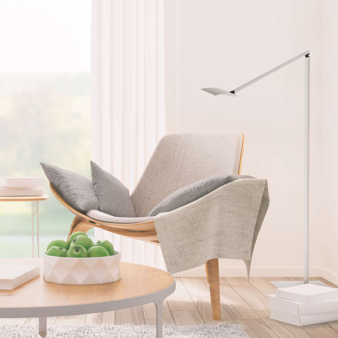 Mosso Pro LED floor lamp by Koncept positioned beside reading chair