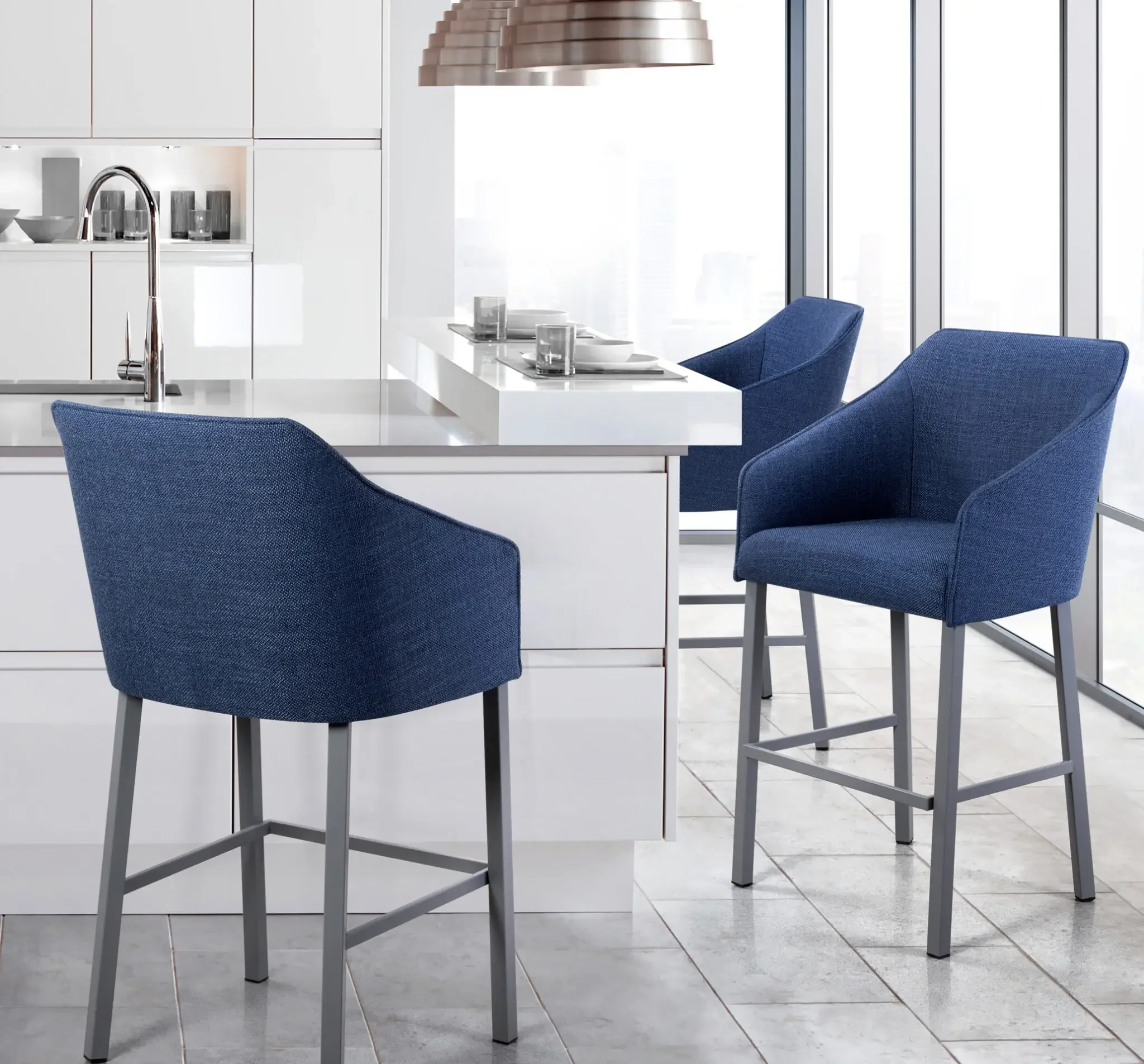 Pair of Sarah II Stools in blue fabric at modern kitchen island