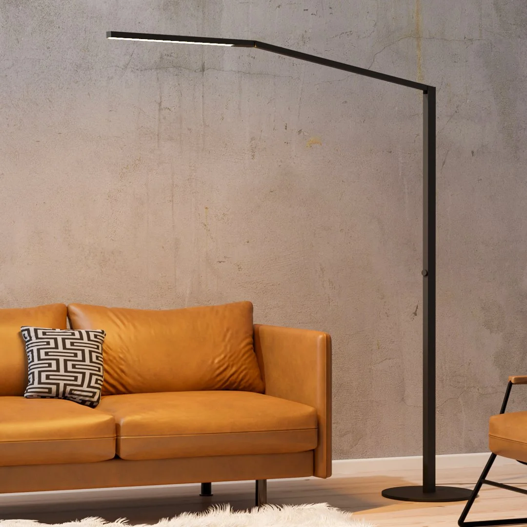 Black Koncept Z-Bar Titan Floor Lamp beside a sofa in a modern living room