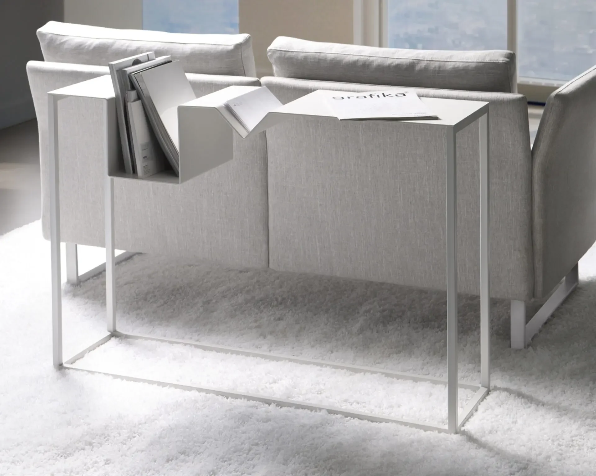 Zigzag Console Table positioned behind a sofa with décor items