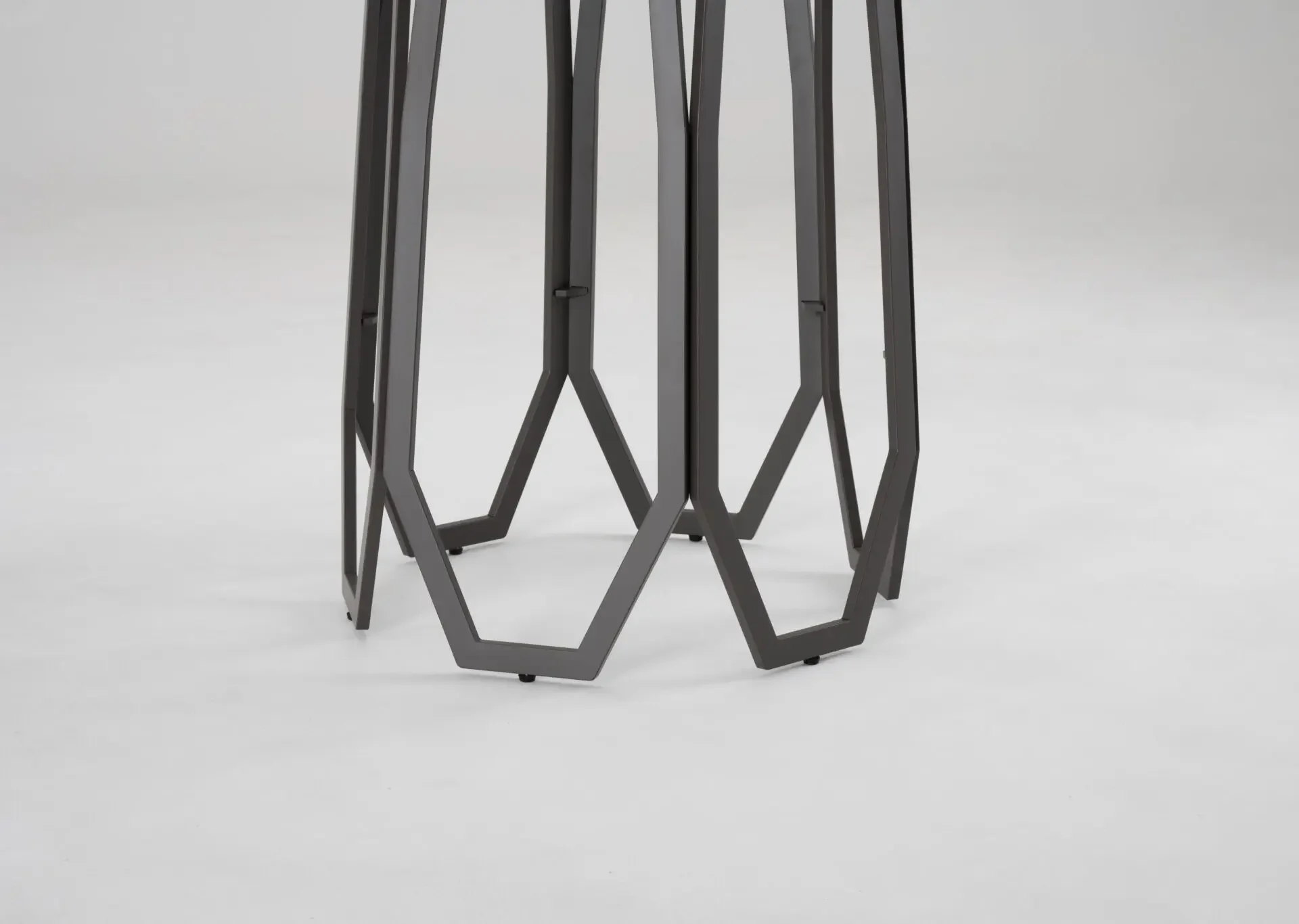 Side view of the Opal Counter-Height Table with geometric black metal base