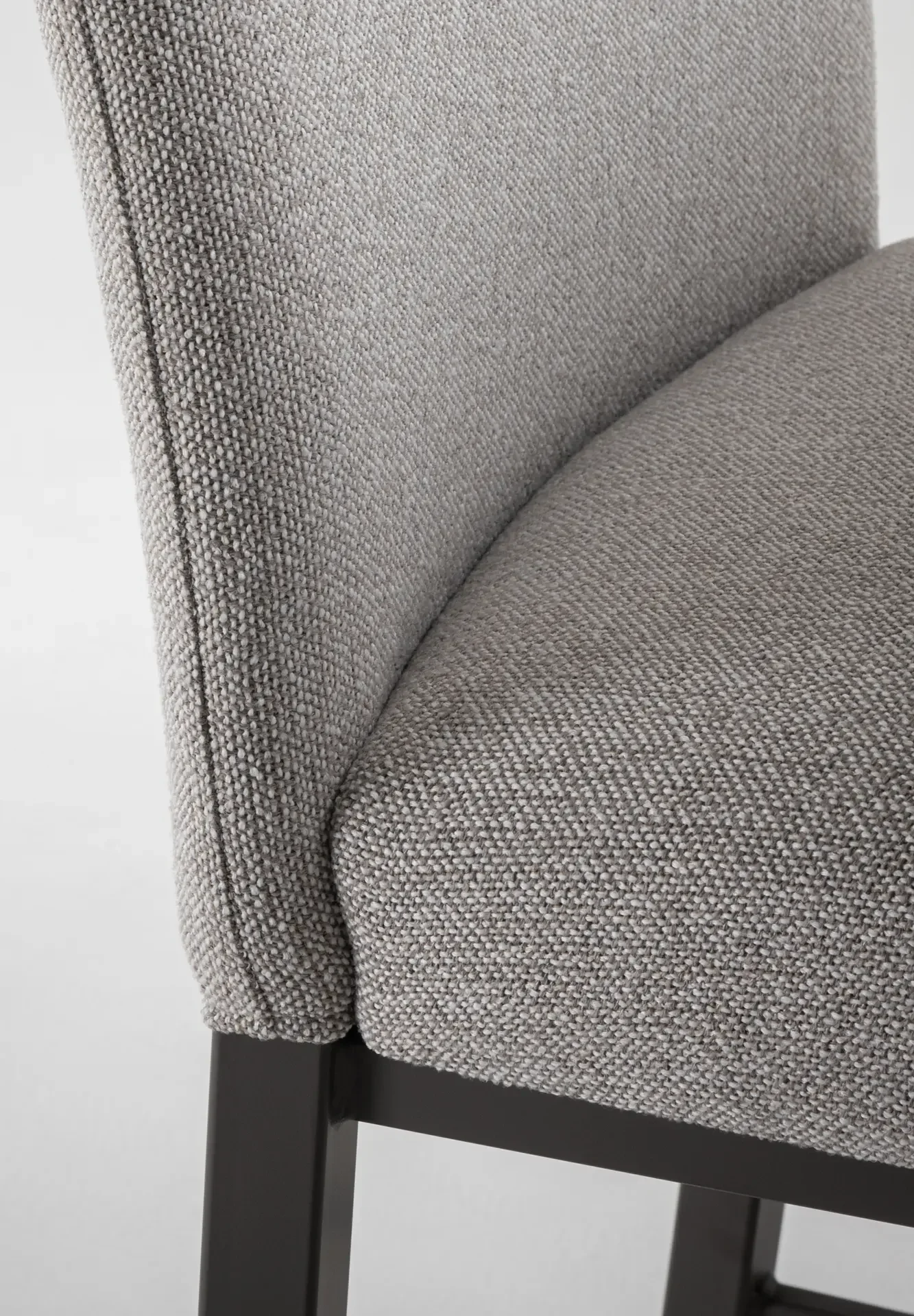 Close-up of textured grey fabric upholstery on Trica Biscaro Counter Stool