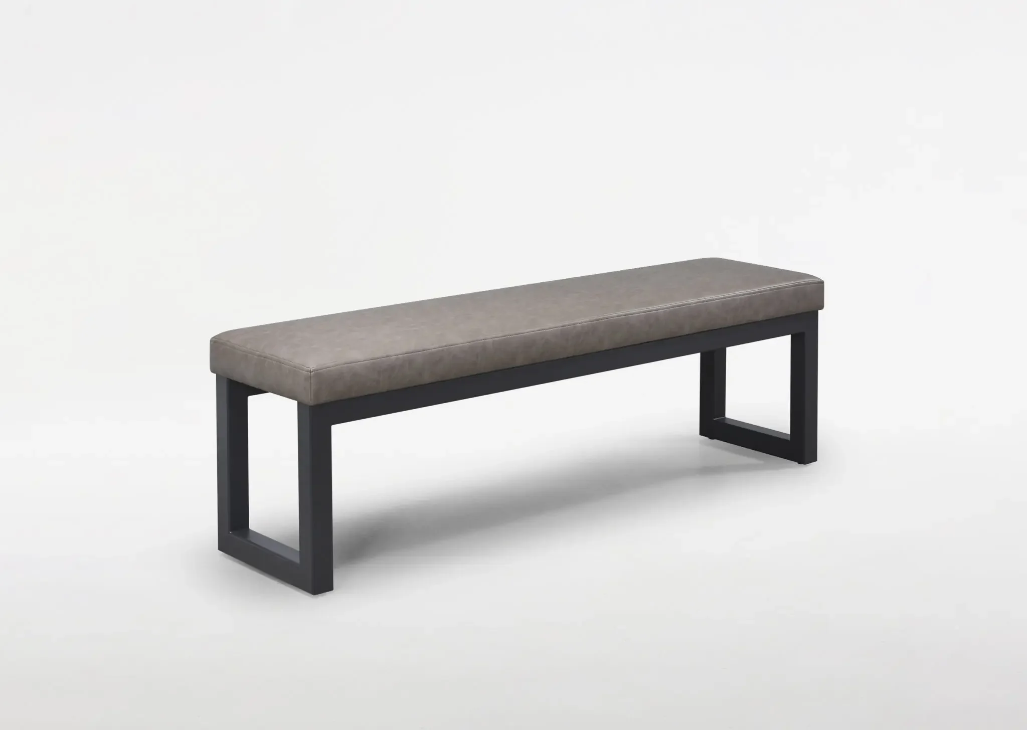 Tubo Bench angled view showing cushioned top and metal legs