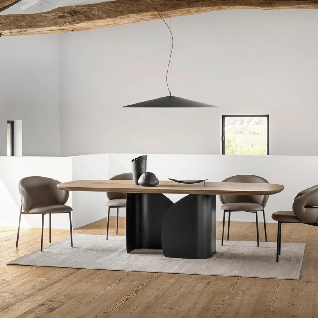 Twins Table in a modern dining room with beige chairs and pendant light