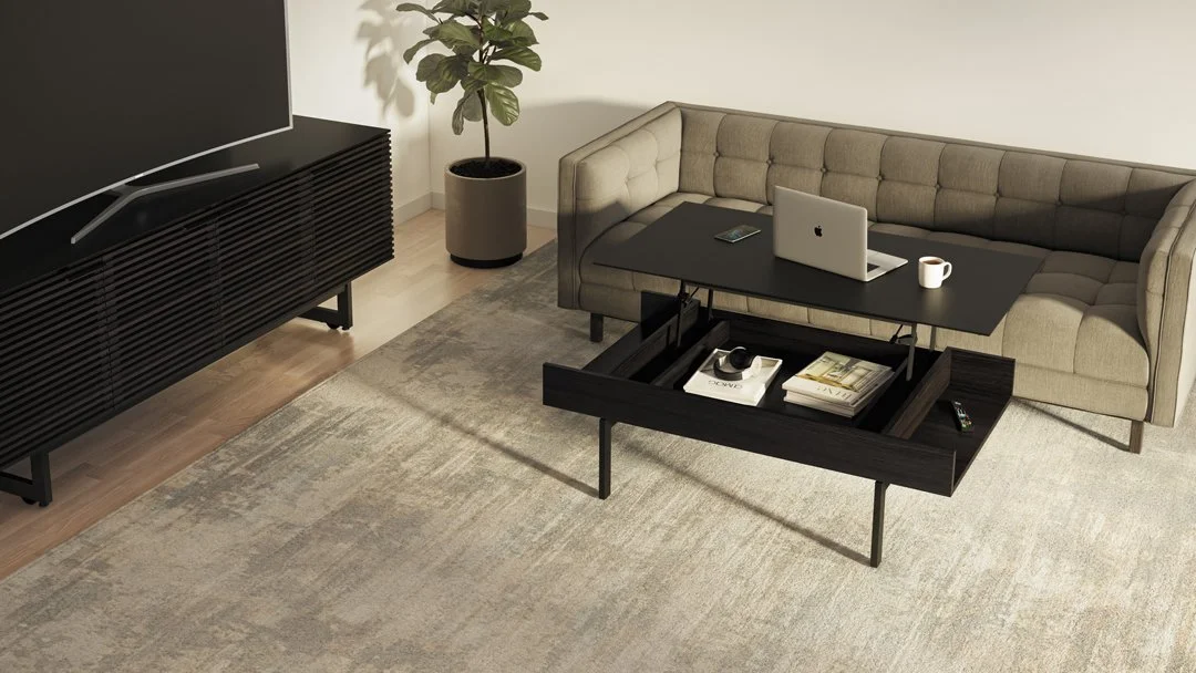 Living room setting with Reveal Lift Coffee Table in raised position used as workspace