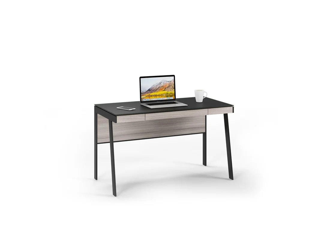 Sigma Compact Desk staged with laptop and mug, front-facing view in dark wood finish
