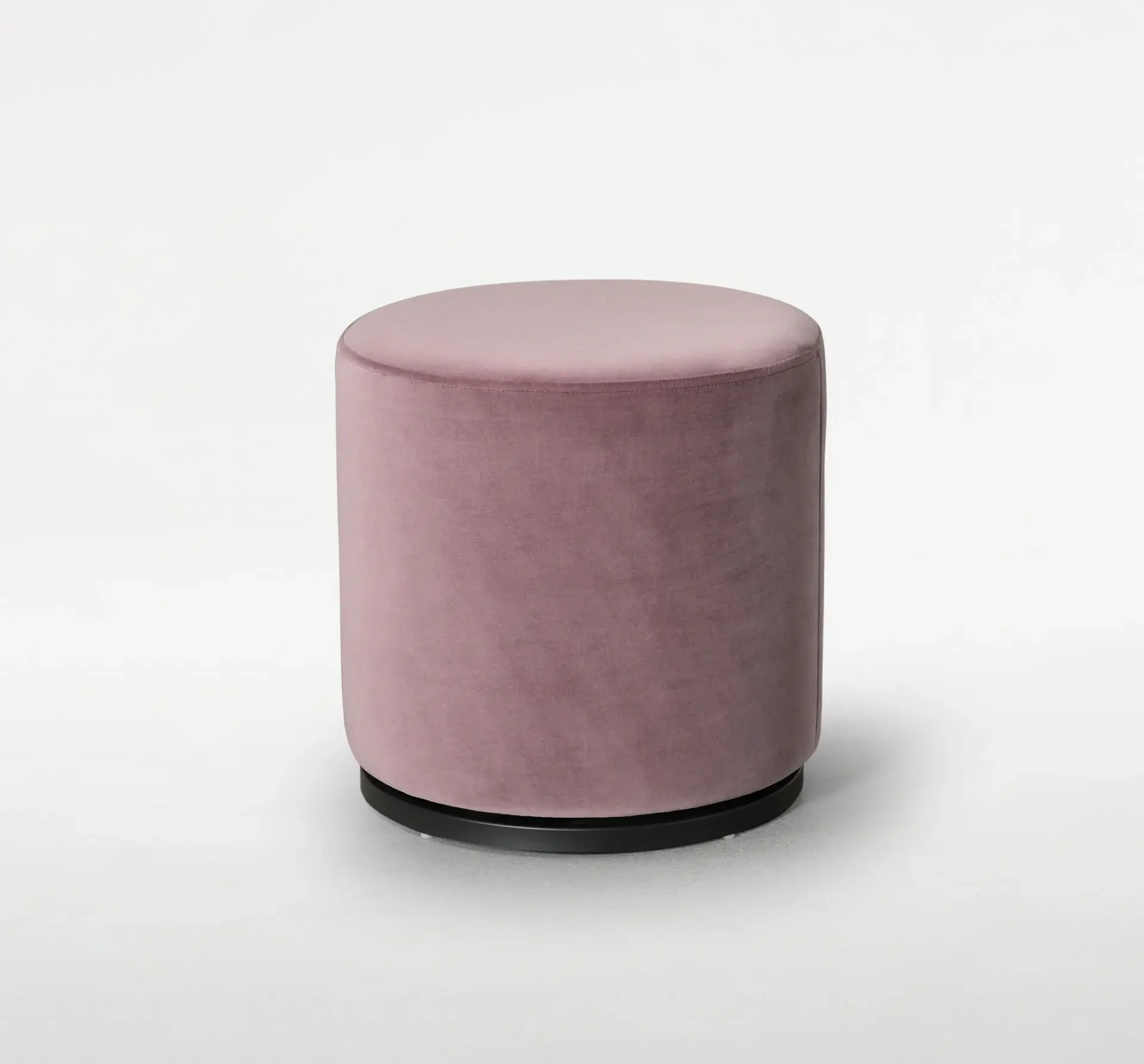 Trica Marshmallow Ottoman in blush pink upholstery with round silhouette on white background