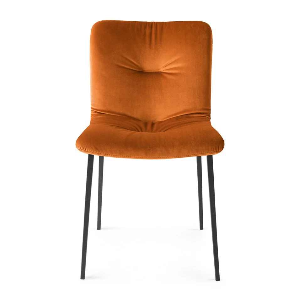 Annie Soft Chair in rust orange with plush upholstery and black legs
