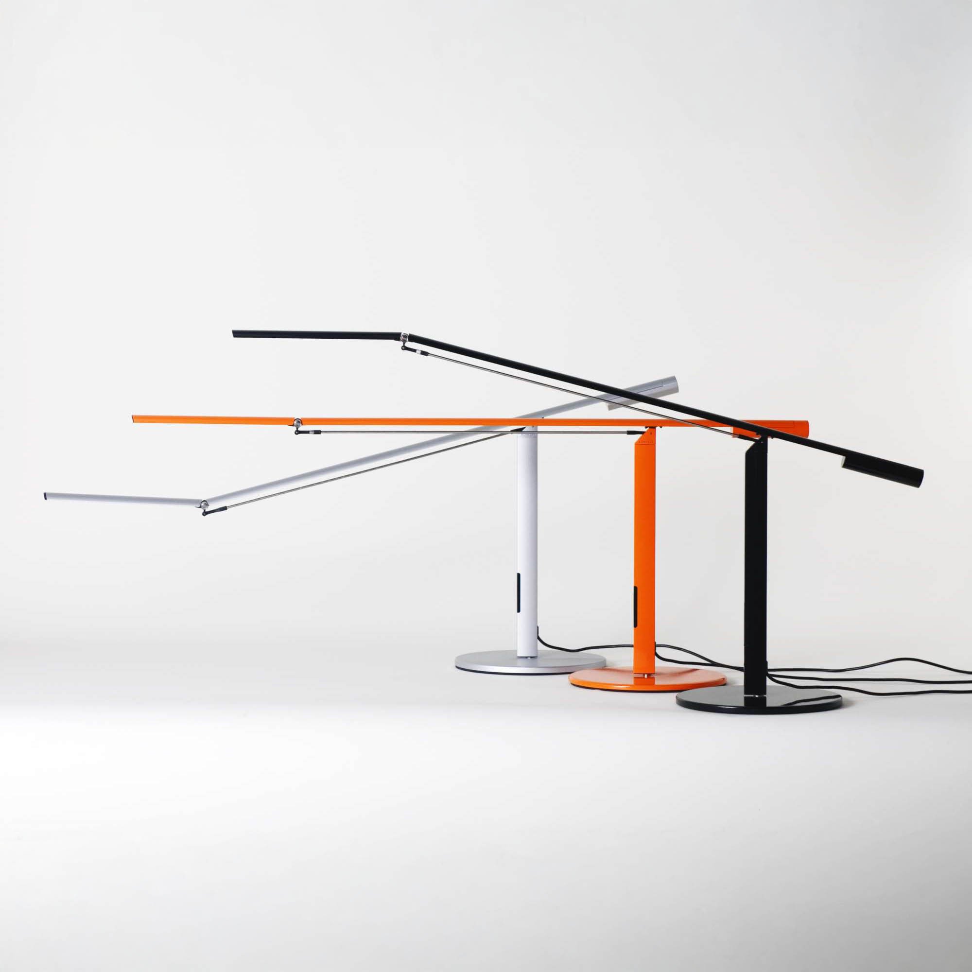 Koncept Equo Desk Lamp collection in black, silver, and orange finishes, modern LED desk lighting.