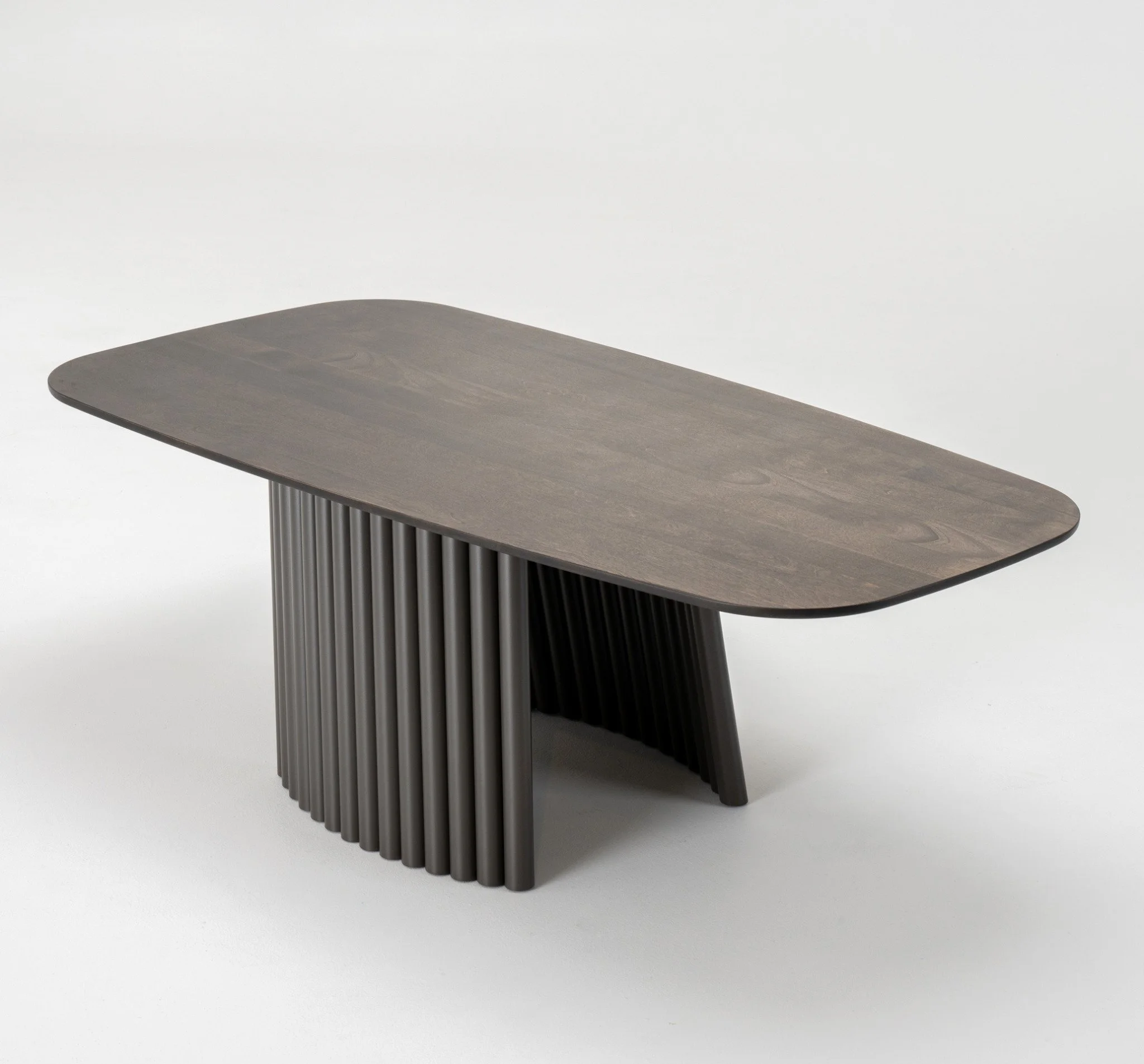 Angled side view of Pisa Cocktail Table showing modern pedestal base